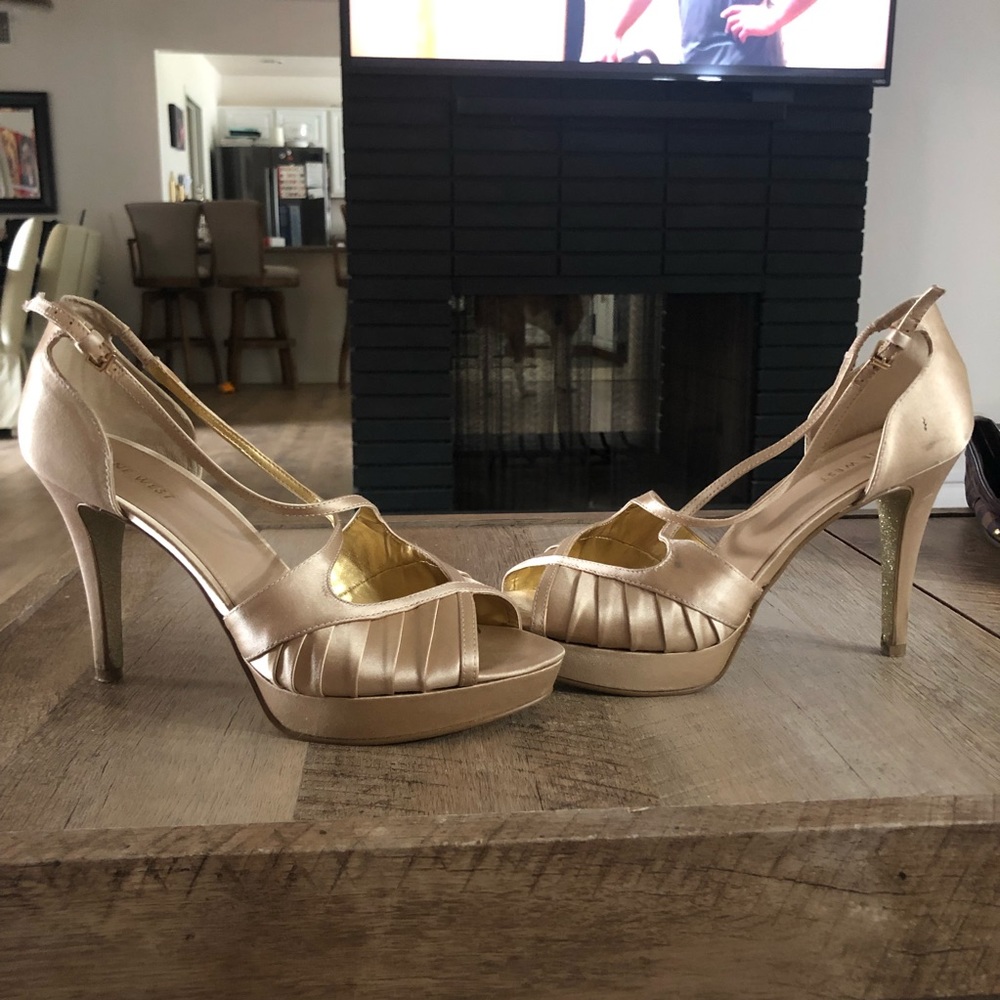 Gold Nine West Bumble Lion heels.